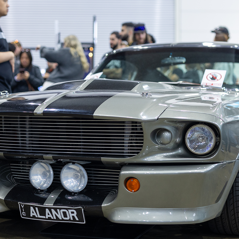Submit A Vehicle 1 Classic Ford Mustang with black racing stripes on display at Melbourne Motor Show 2026